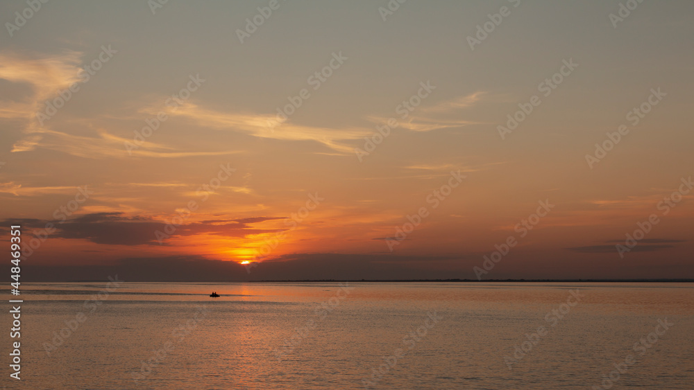 silhouette of rubber boat and golden sunset,Surin Island National park, Thailand silhouette of rubber boat and golden sunset,Surin Island National park, Thailand
