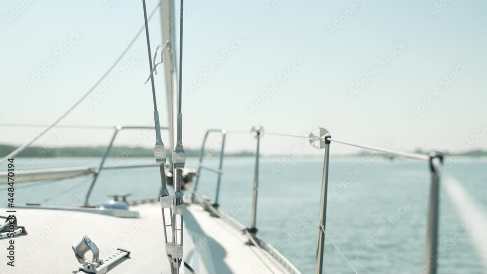 Front view of a sailing ship with focus on the ship and the ropes