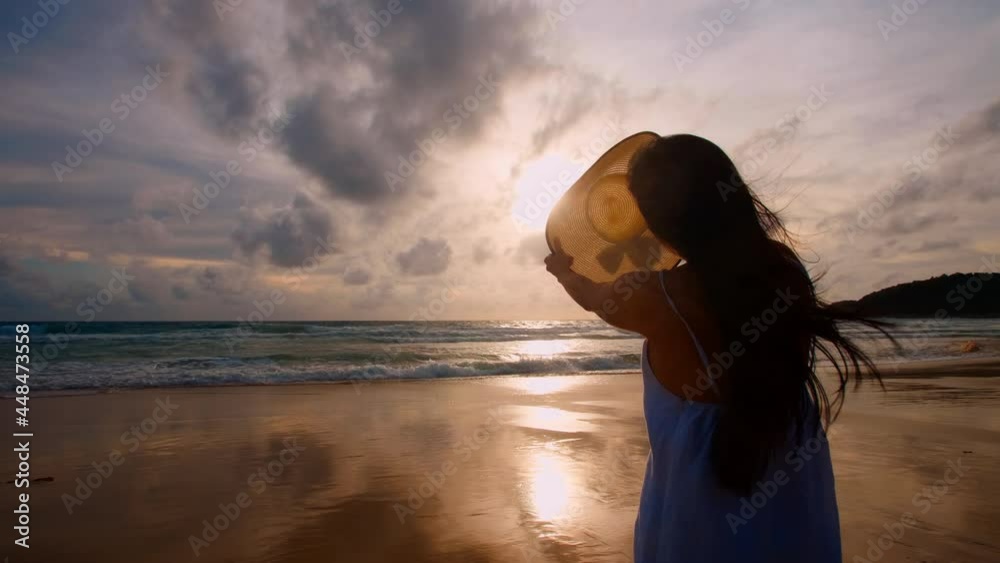 4K Back view beautiful women stand on the beach with sunset overseas. Happy tourist women stand on the beach relax enjoy with sunset. Phuket, Thailand freedom paradise beach. Vacation holiday summer 4K Back view beautiful women stand on the beach with sunset overseas. Happy tourist women stand on the beach relax enjoy with sunset. Phuket, Thailand freedom paradise beach. Vacation holiday summer