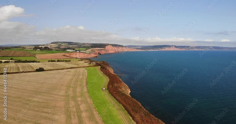 Aerial Over Farmland Countryside Landscape Beside English Channel In Devon. Pedestal Up Aerial Over Farmland Countryside Landscape Beside English Channel In Devon. Pedestal Up