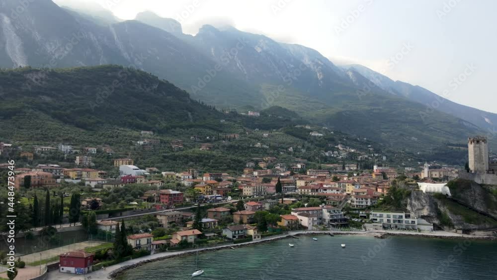 Aerial view of Malcesine, visit the roamantic town old in history, with a great waterfront view of Lake Garda Italy. Castle on the cliff. Aerial view of Malcesine, visit the roamantic town old in history, with a great waterfront view of Lake Garda Italy. Castle on the cliff.
