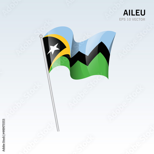 Waving flag of Aileu districts of Timor Leste on gray background photo