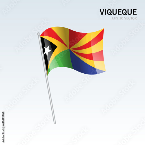 Waving flag of Viqueque districts of Timor Leste on gray background photo