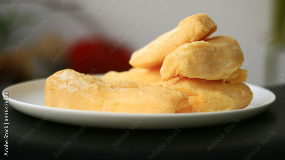 Fermented cassava or tape singkong on white plate. 