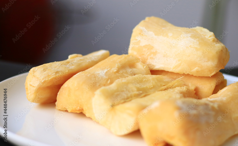 Fermented cassava or tape singkong on white plate. Fermented cassava or tape singkong on white plate.