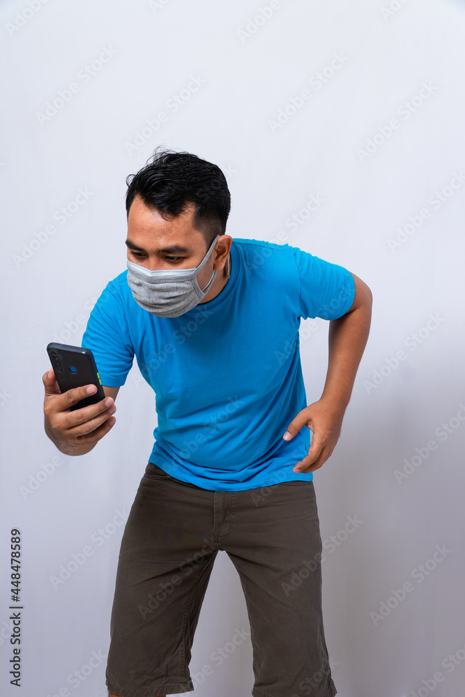 a man wear double mask. a man wears a medical mask and a cloth mask to protect from the covid-19 virus a man wear double mask. a man wears a medical mask and a cloth mask to protect from the covid-19 virus