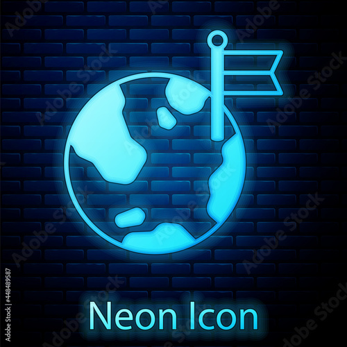 Glowing neon Planet with flag icon isolated on brick wall background. Victory, winning and conquer adversity concept. Vector