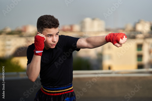 Kickbox fighter training in urban environment © Xalanx