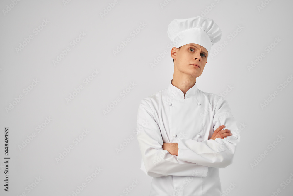 a man in a chef's uniform professional work in a restaurant a man in a chef's uniform professional work in a restaurant