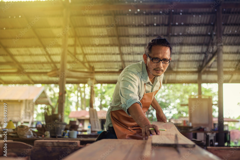 Carpenter Woodwork and furniture making in carpentry workshop