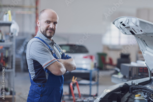 Professional mechanic posing in the workshop