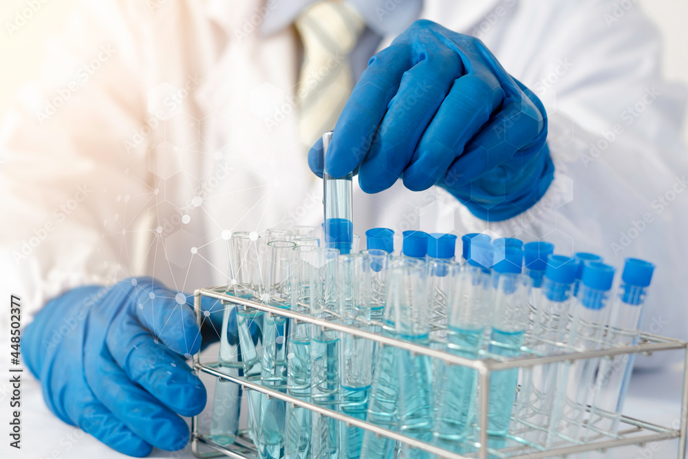 Doctor holding test tube with sample for analysis in laboratory, closeup Doctor holding test tube with sample for analysis in laboratory, closeup