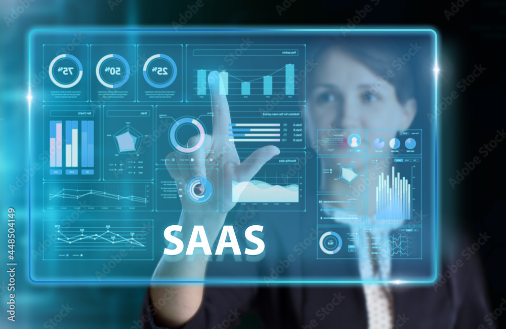 Obraz premium Business, Technology, Internet and network concept. Young businessman working on a virtual screen of the future and sees the inscription: SAAS