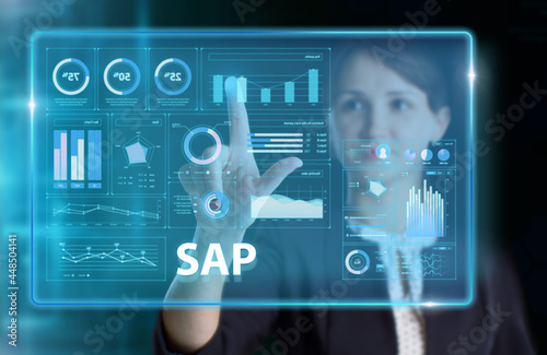 Business, Technology, Internet and network concept. Young businessman working on a virtual screen of the future and sees the inscription: SAP