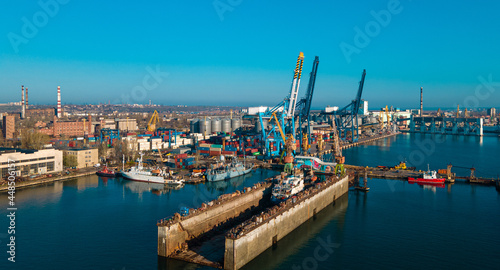 Industrial port in the field of import-export global business logistics and transportation  Loading and unloading container ships  cargo transportation from a bird s eye view.