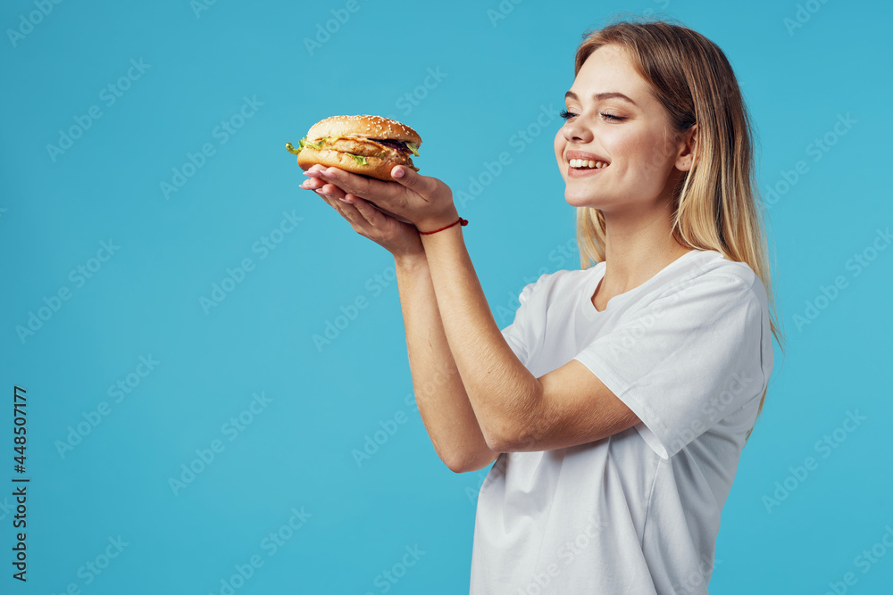 woman with hamburger fast food delivery snack fun blue background woman with hamburger fast food delivery snack fun blue background