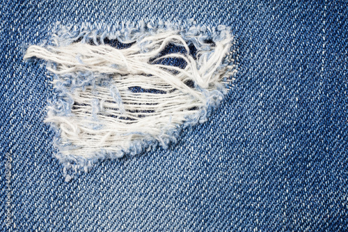 Jeans torn denim texture.