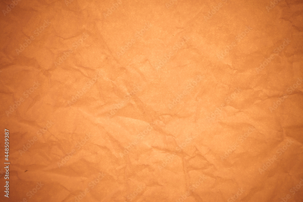 Fototapeta premium Crumpled brown paper background.