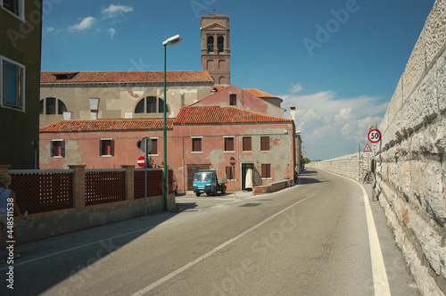 Pellestrina, Venezia. Strada sotto i murazzi. Imponente diga in pietra d'Istria, costruita dalla Repubblica di Venezia per difendere gli argini della laguna dall'erosione del mare. photo