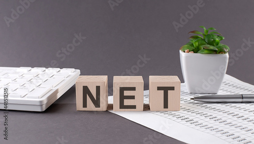 NET wooden block , business concept background with chart ,pen, keyboard