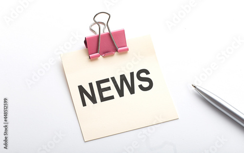 NEWS text on sticker with pen on the white background