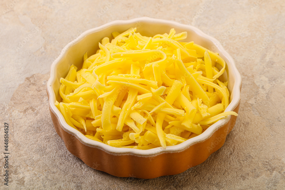 Shredded yellow cheese in the bowl Shredded yellow cheese in the bowl