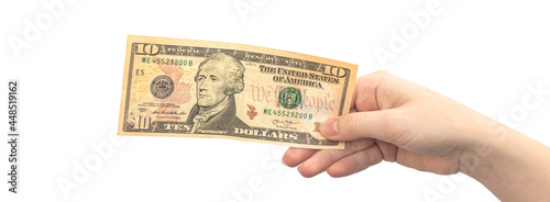 Ten dollars in hand isolated on white background, woman hand with banknote, american money photo