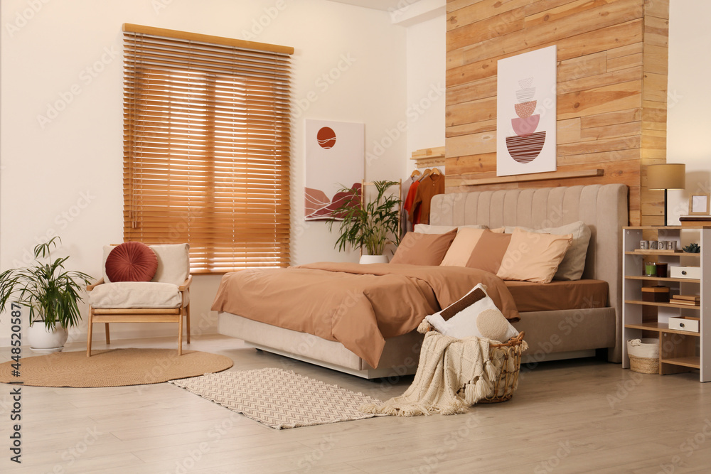 Obraz premium Comfortable bed with stylish linens. Interior design