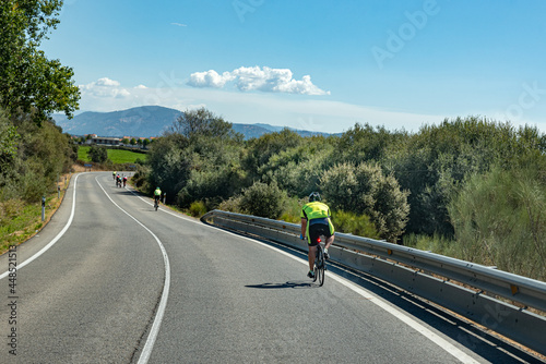Cyclists speeding down the road