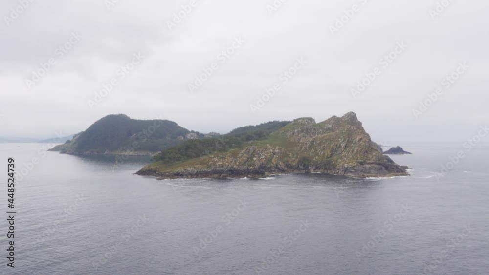 A Mysterious, Uninhabited Island in the Cies Islands Chain in a Cloudy, Moody Weather A Mysterious, Uninhabited Island in the Cies Islands Chain in a Cloudy, Moody Weather