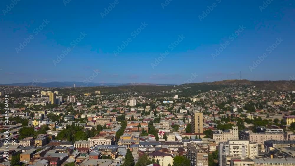 A smooth slow drone flight in a clear view under the blue sky, Tbilisi of the capital and the largest city of Georgia. A smooth slow drone flight in a clear view under the blue sky, Tbilisi of the capital and the largest city of Georgia.