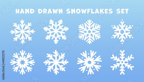 Set of hand drawn doodle snowflakes icons on blue background. New year and winter simple symbol, cute snowflake for print, web, design, decoration, logo or mobile app