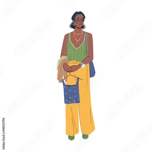 Stylish modern woman in fashion clothes isolated flat cartoon character holding shirt on hangers to try on. Vector fashionable lady summer vogue. Lady in urban outfit, stylish yellow pants and blouse