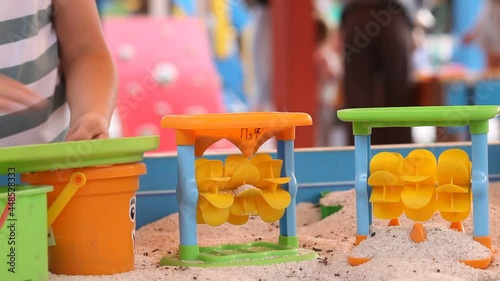 Wallpaper Mural Little kid girl playing at the outdoor playground with sand and toys Torontodigital.ca