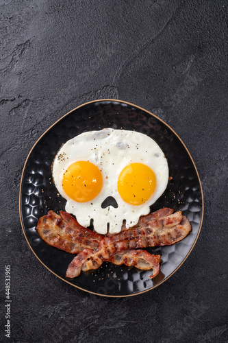 Fried eggs in the shape of a skull. Halloween healthy breakfast photo