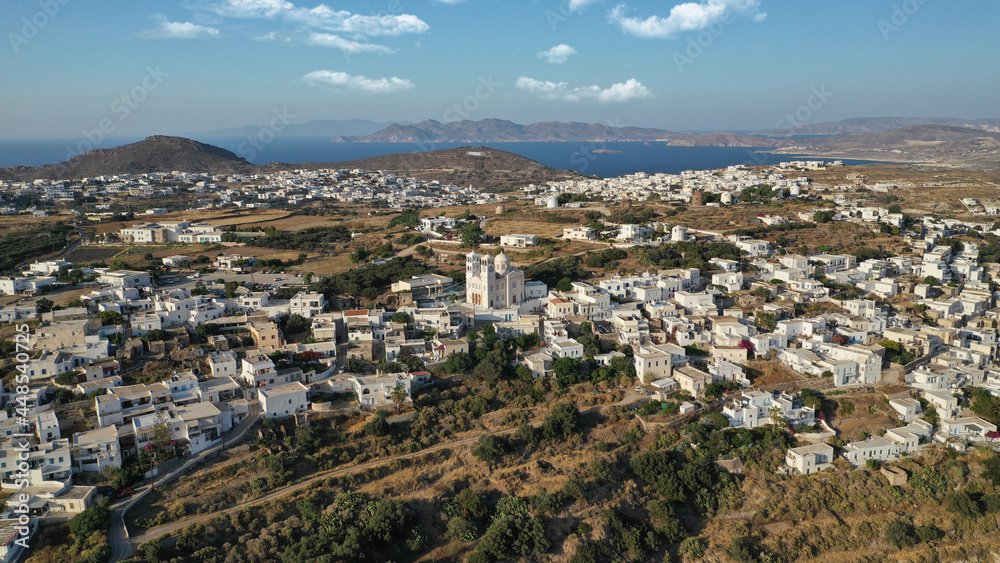 Aerial drone photo of picturesque uphill village of Tripiti with great views to bay of Adamantas near main town and capital of Milos island, Cyclades, Greece