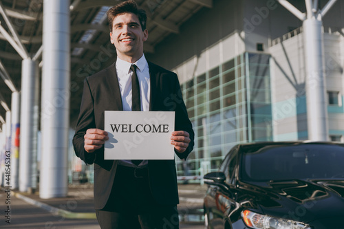 Photography Bottom view young cheerful friendly traveler businessman man 20s in black suit s