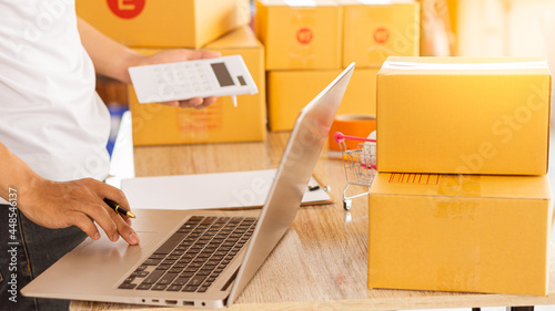 Starting a Small BusinessEntrepreneurship Asian SME work with boxes and laptops to take orders. At home, office, warehouse, online marketing package delivery, SME e-commerce concept.