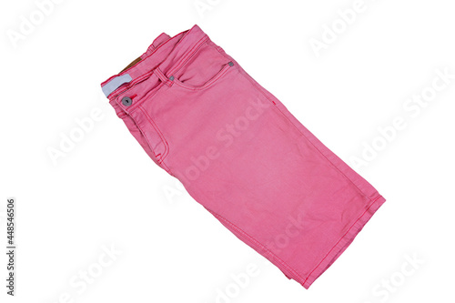 folded pink shorts on white background  Pink jeans shorts isolated over white