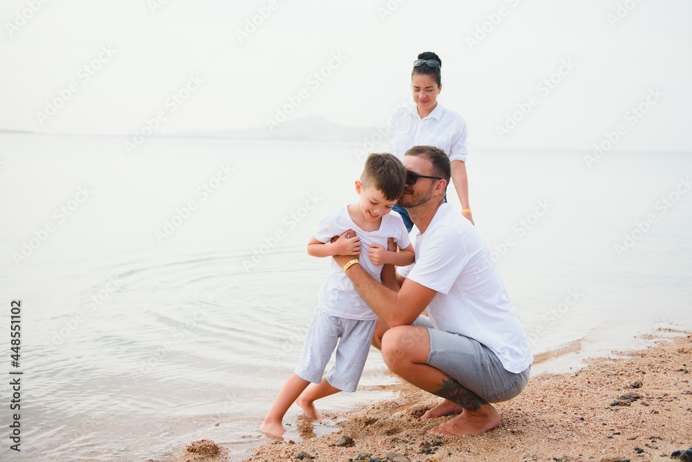 Cute happy family having fun on luxury tropical resort, mother with child, summer holidays, love concept Cute happy family having fun on luxury tropical resort, mother with child, summer holidays, love concept