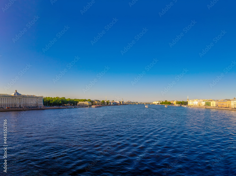 Dawn over the city, St. Petersburg. Russia. Water view of the Admiralty building and the Palace Bridge.