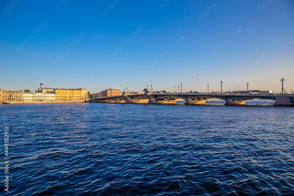 View of the river, panorama of the summer sunset St. Petersburg. Russia. Blagoveshchensky Bridge, Neva River, English Embankment, Sphinxes of the Academy of Arts, Vasilievsky Island.