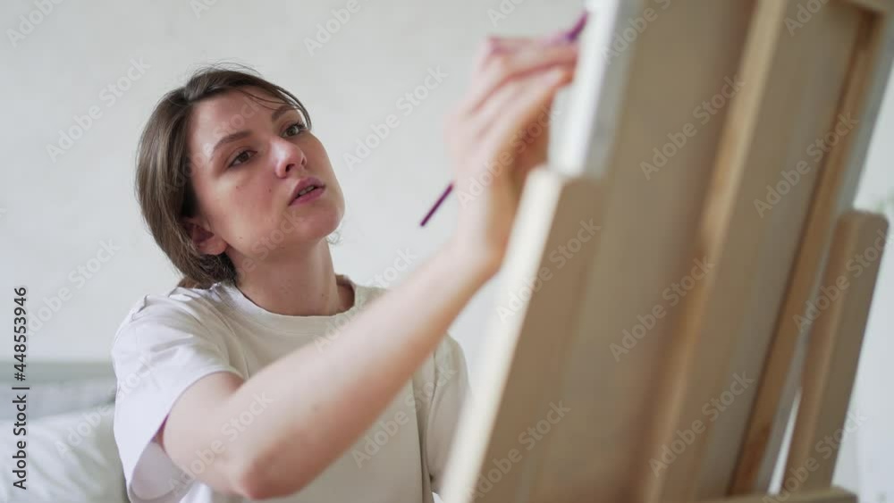 Professional painter. Work with brushes for drawing. The Face of a Focused Artist Professional painter. Work with brushes for drawing. The Face of a Focused Artist