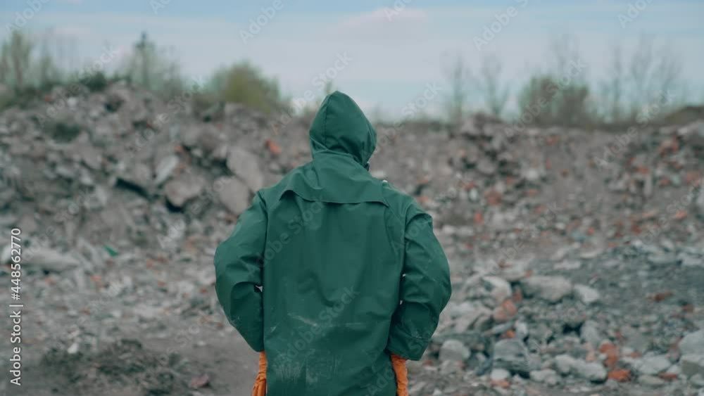 Man dancing in radioactive suit in abandoned city. Apocalyptic concept architecture. Man dancing in radioactive suit in abandoned city. Apocalyptic concept architecture.
