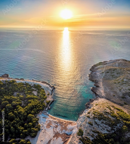 beautiful sunrise on a clean sandy beach on a mediterranean island