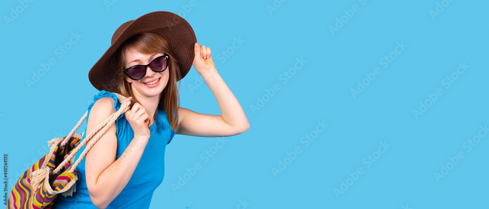 Portrait of young stylish blonde woman in casual clothes in sunglasses and hat on the head in summer vacation. Portrait of young stylish blonde woman in casual clothes in sunglasses and hat on the head in summer vacation.