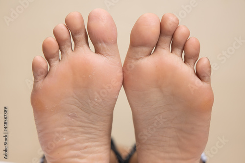 Closeup of a female foot sole  on a white background © Teerapong