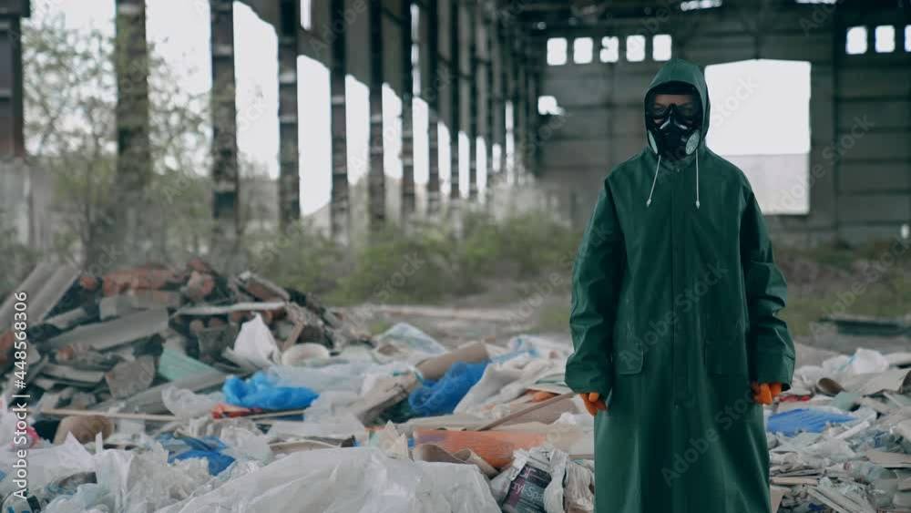 Apocalyptic concept architecture. Man in radioactive suit in abandoned city. Apocalyptic concept architecture. Man in radioactive suit in abandoned city.
