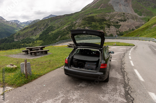 The black car is parked at the rest area on the Grossglockner High Alpine Road. Austria © kelifamily