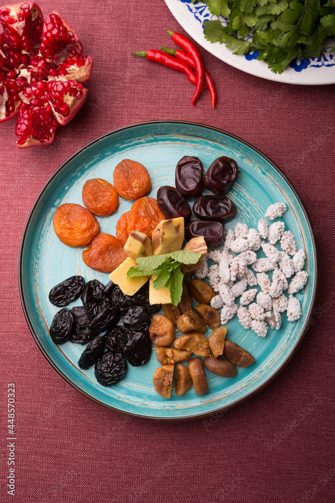 Set of different dried fruits and berries served in a restaurant
